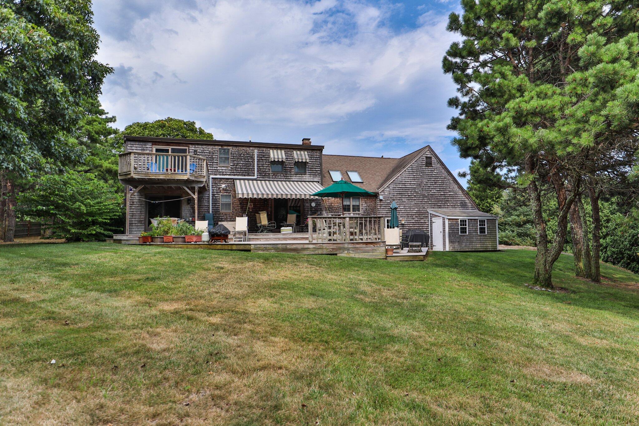 106 Castle Road Truro, MA 02666 - Photo 45 of 47 front view of a house with a big yard