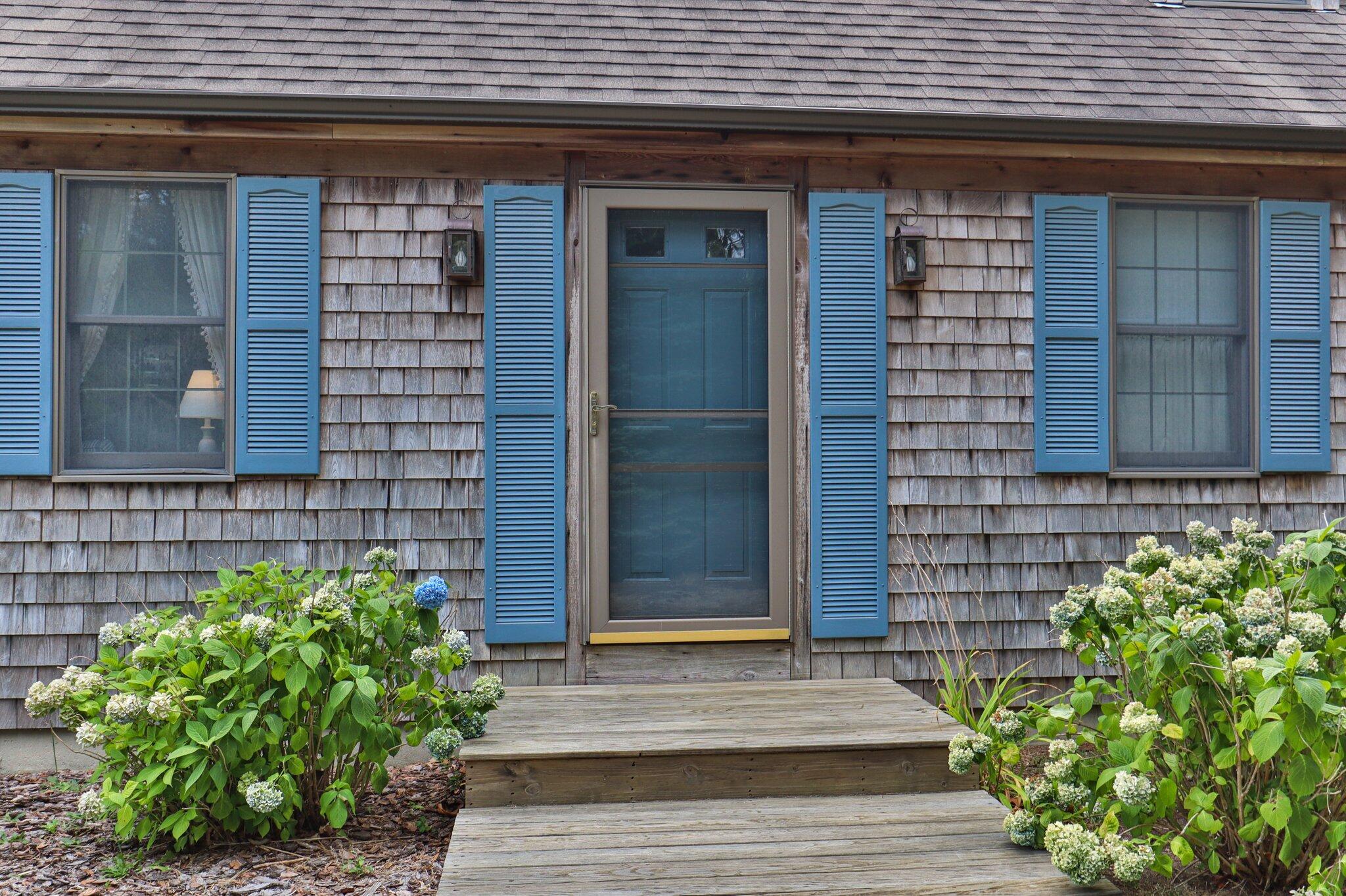 106 Castle Road Truro, MA 02666 - Photo 8 of 47 a front view of a house with a garden