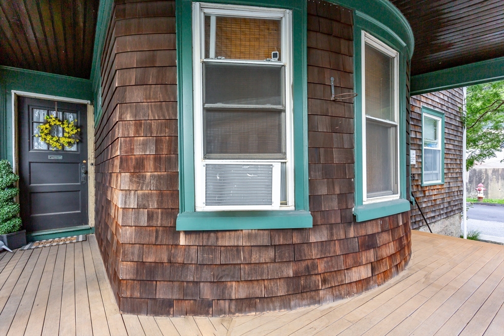 256 Maple Street Fall River, MA 02720 - Photo 2 of 41 a front view of a house with a glass door