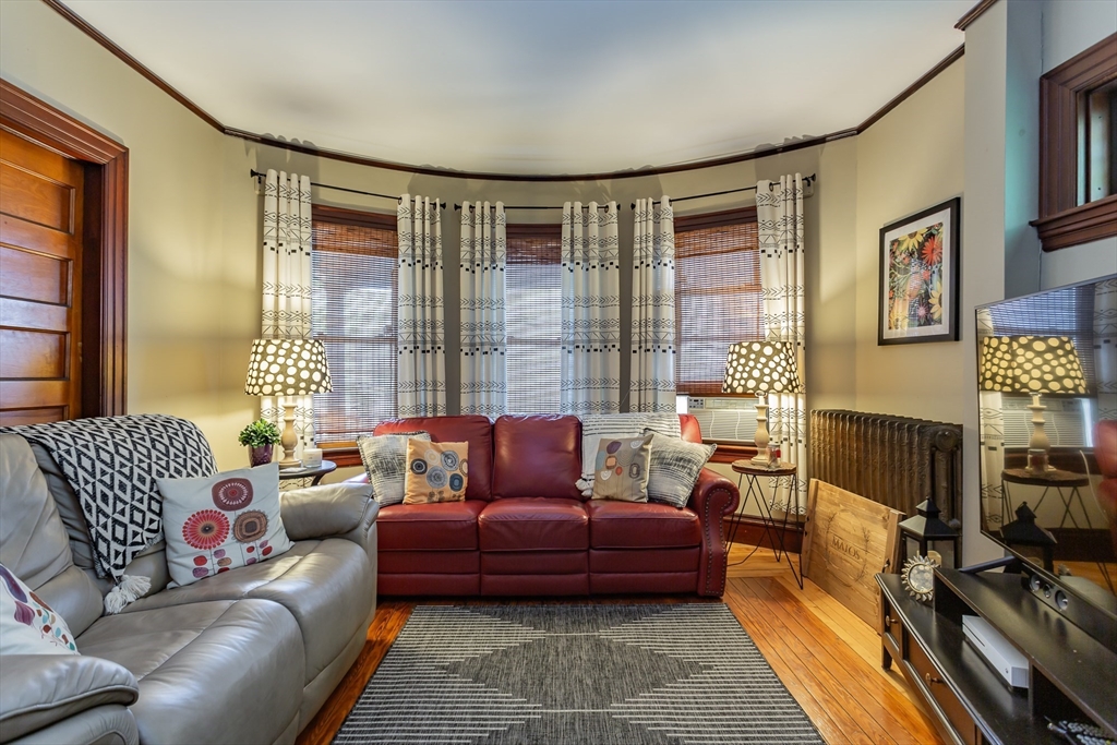 256 Maple Street Fall River, MA 02720 - Photo 8 of 41 a living room with furniture or couch and a flat screen tv