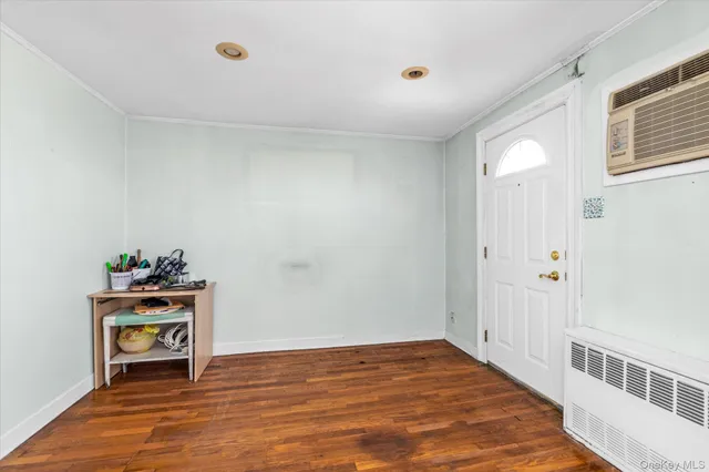 a view of a livingroom with an empty space and a window