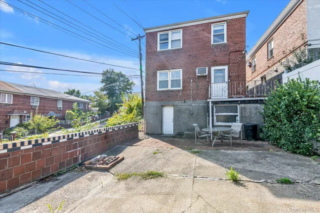 a brick building with a bench in front of it