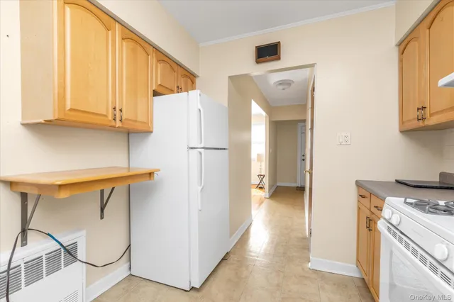 a view of a kitchen with a sink and cabinets