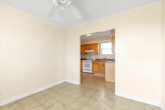 a view of open kitchen with granite countertop cabinets and appliances