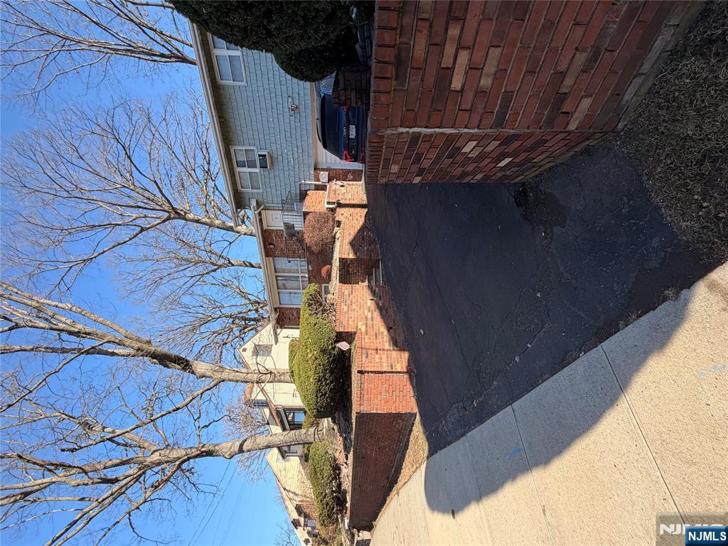 a view of a patio with table and chairs with wooden fence and plants