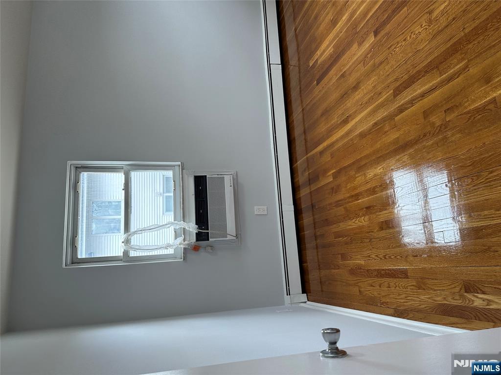 1032 Glen Road Fort Lee, NJ 07024 - Photo 15 of 16 a view of a room with wooden floor and window