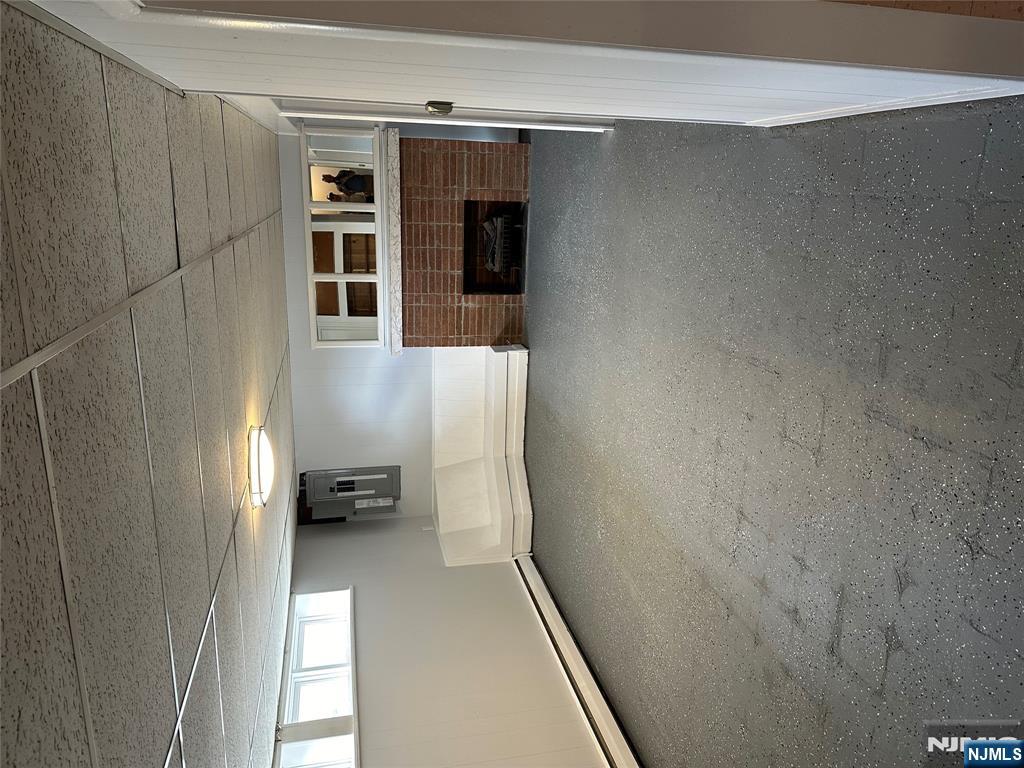 1032 Glen Road Fort Lee, NJ 07024 - Photo 16 of 16 a view of a livingroom with an empty space and workspace