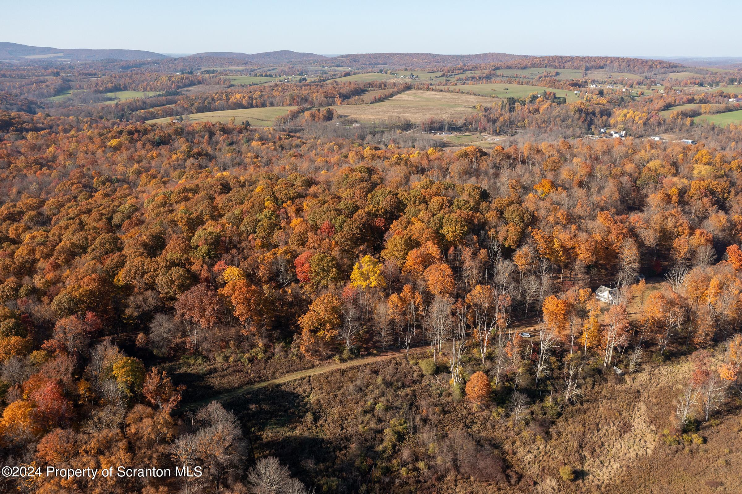 1736 Falls Road Clarks Summit, PA 18411 - Photo 4 of 26 an aerial view of house with yard and mountain view in back