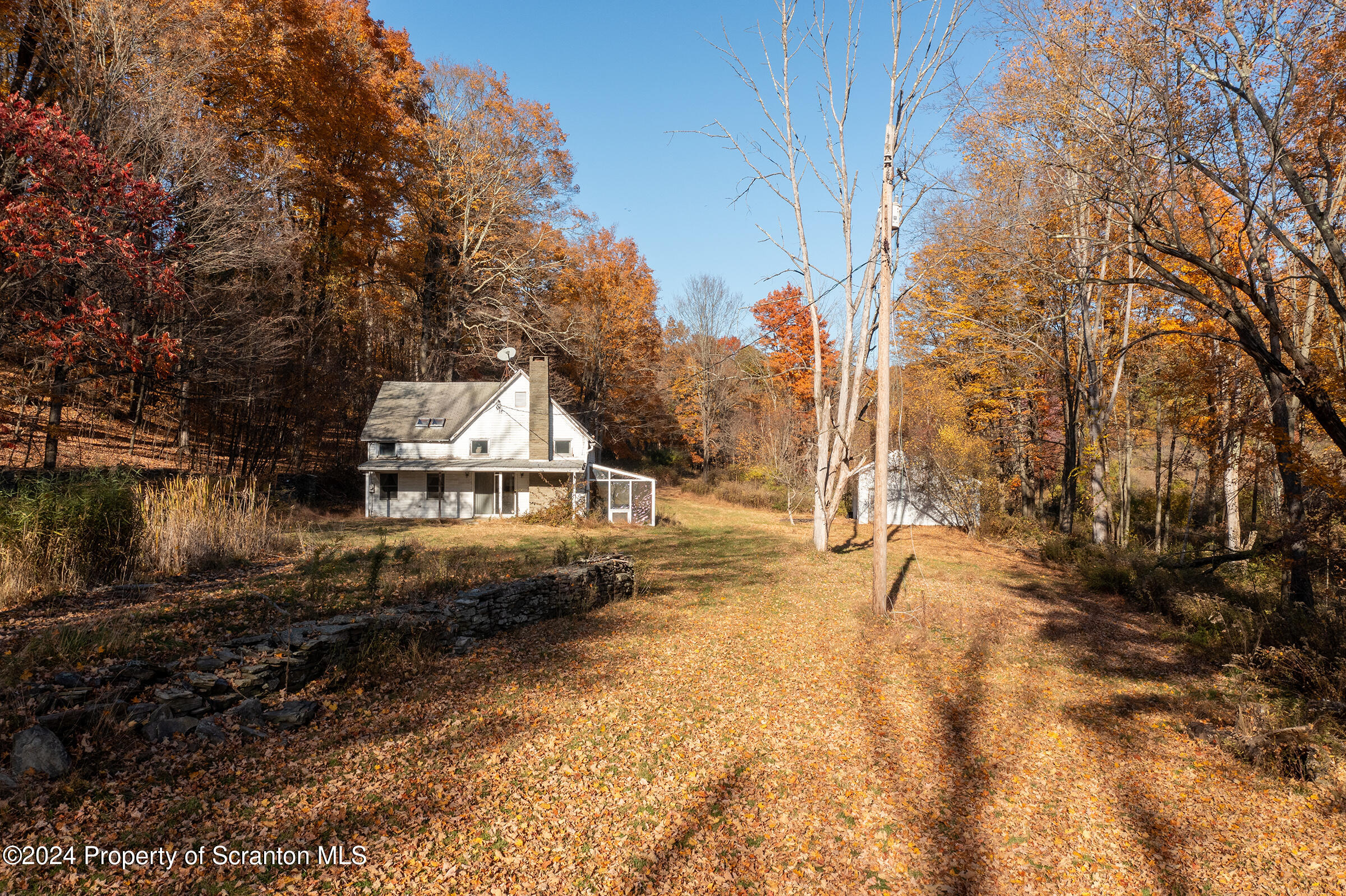 1736 Falls Road Clarks Summit, PA 18411 - Photo 6 of 26 a view of a town with large trees