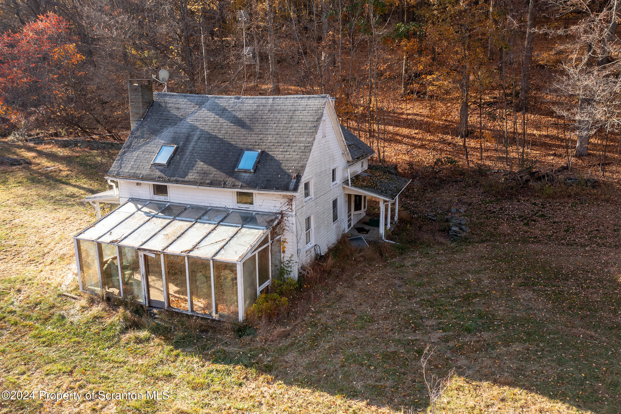 1736 Falls Road Clarks Summit, PA 18411 - Photo 7 of 26 an aerial view of a house with a yard