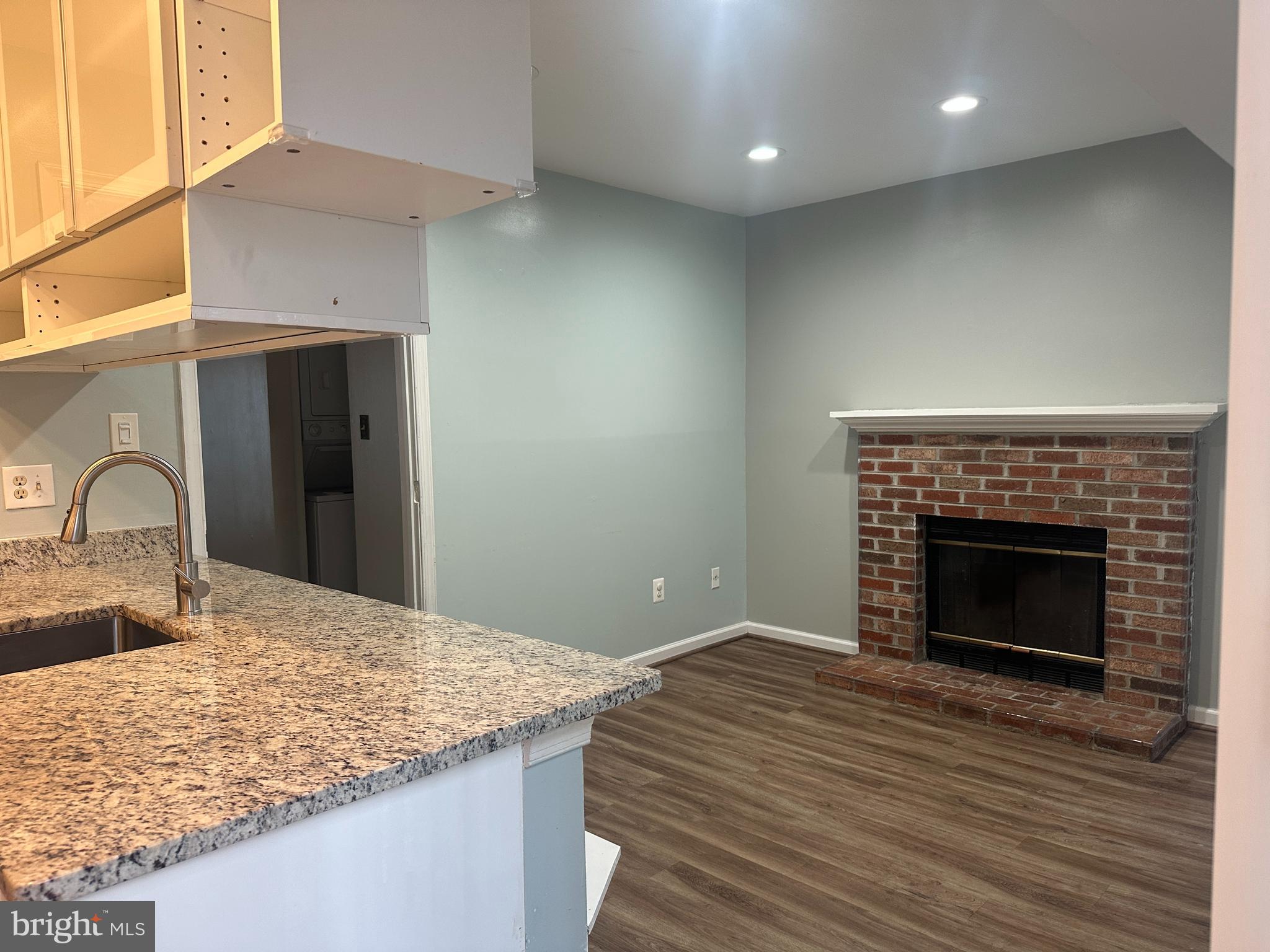 326 Lancaster Square, Unit 326 Sterling, VA 20164 - Photo 15 of 30 a bedroom with a bed and a fireplace