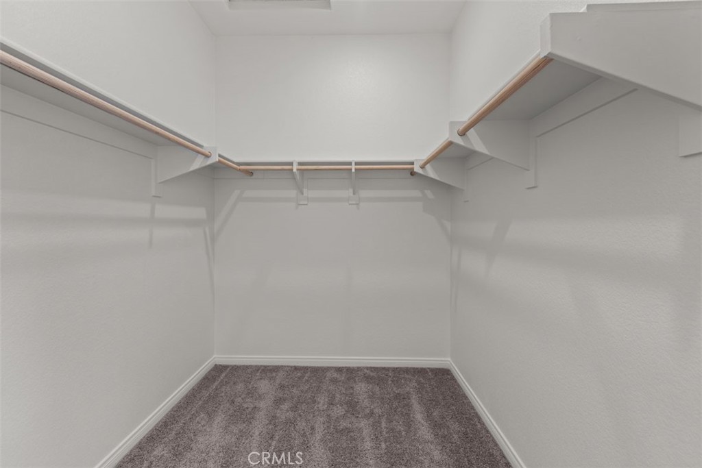 1218 Butterfly Way Banning, CA 92220 - Photo 12 of 16 a view of an empty walk in closet