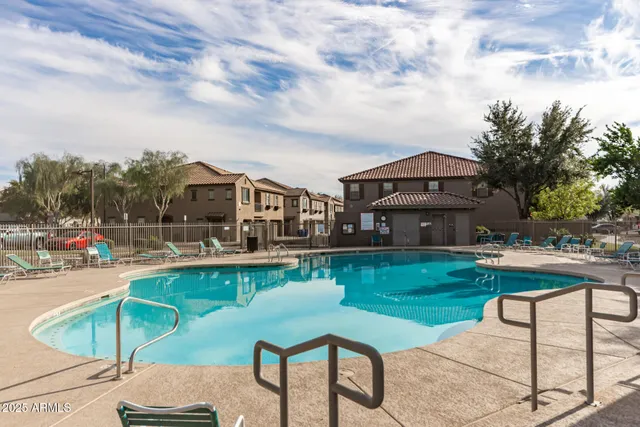 a view of a house with backyard porch and sitting area