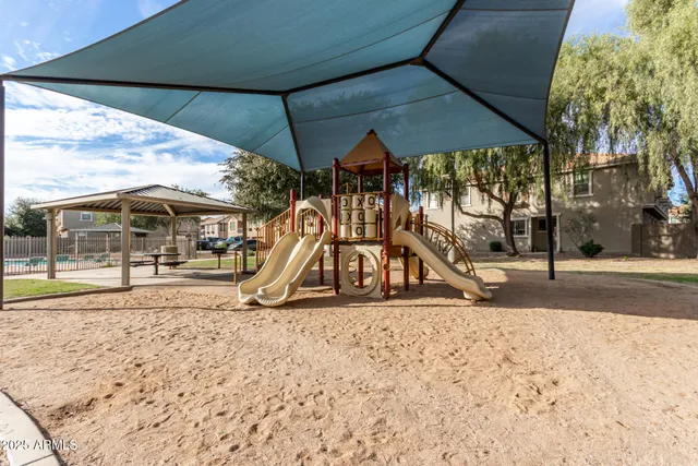 a view of park with a slide