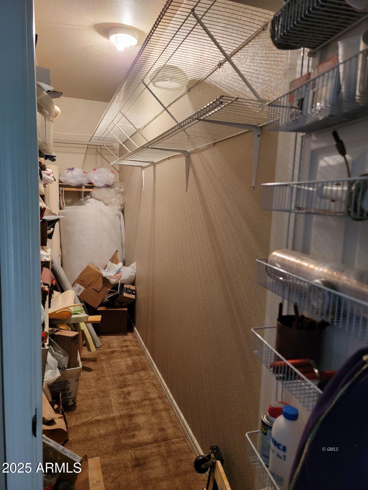 9383 Kellner Canyon Road Globe, AZ 85501 - Photo 13 of 32 a picture of water heater room with wooden floor