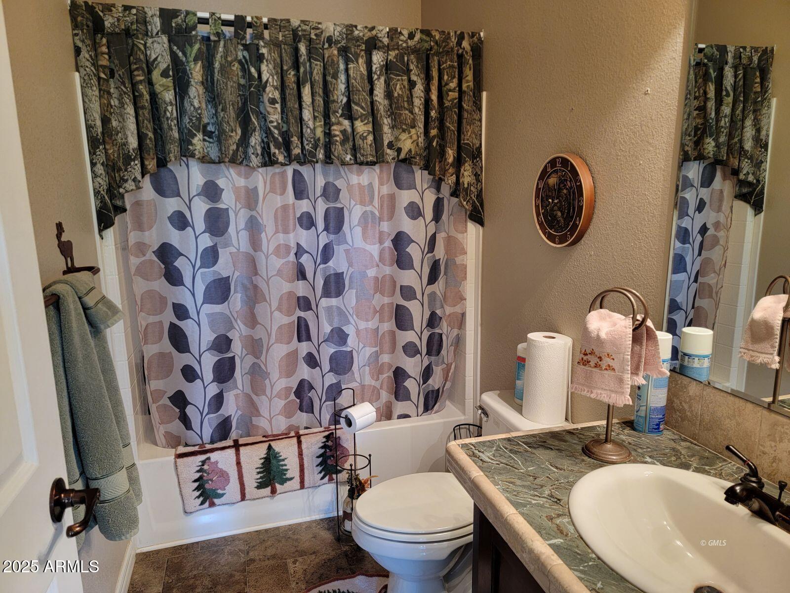 9383 Kellner Canyon Road Globe, AZ 85501 - Photo 14 of 32 a bathroom with a granite countertop sink and a mirror