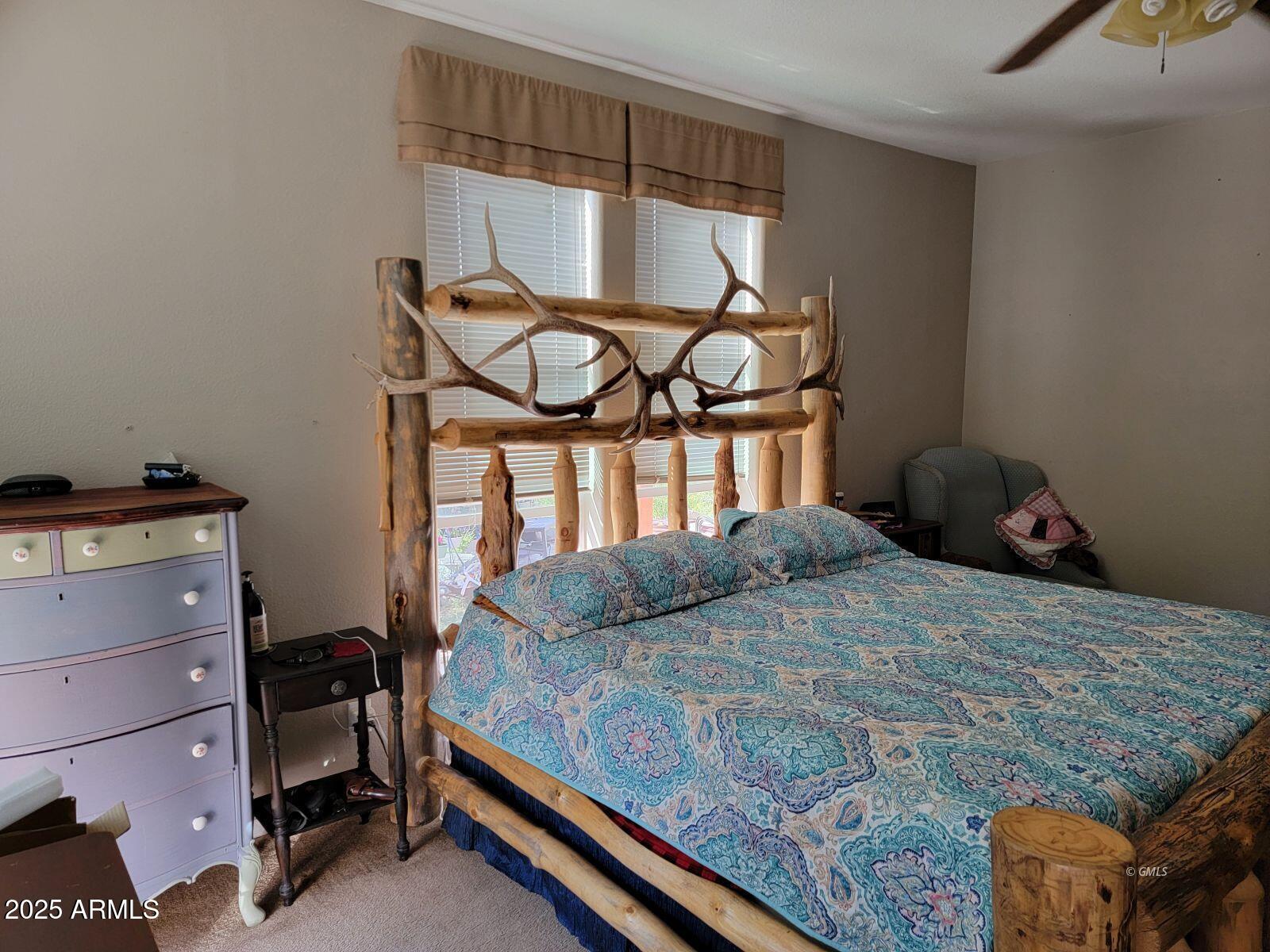9383 Kellner Canyon Road Globe, AZ 85501 - Photo 16 of 32 a bedroom with a bed and two windows