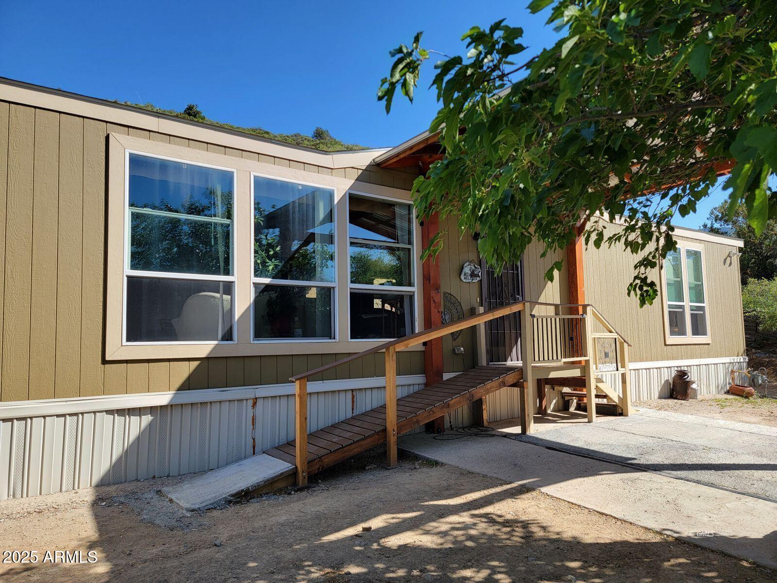9383 Kellner Canyon Road Globe, AZ 85501 - Photo 2 of 32 a view of a house with a large windows