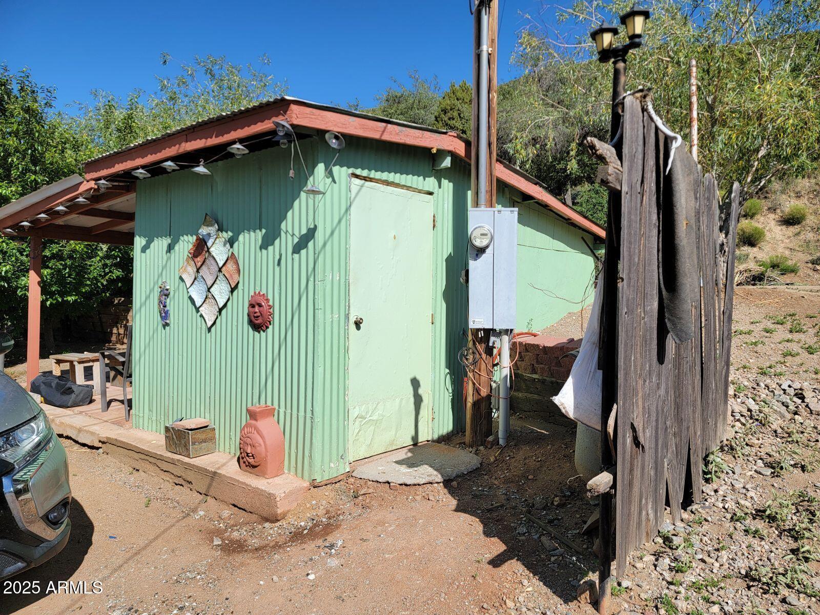 9383 Kellner Canyon Road Globe, AZ 85501 - Photo 28 of 32 a view of a wooden door in the backyard