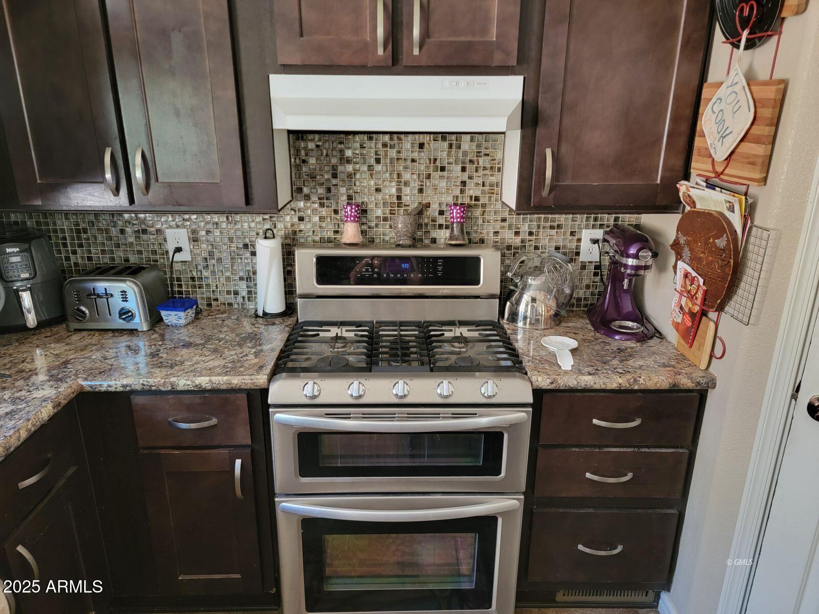 9383 Kellner Canyon Road Globe, AZ 85501 - Photo 9 of 32 a stove top oven sitting inside of a kitchen