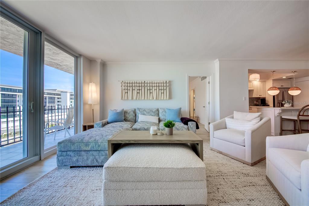 1212 Benjamin Franklin Drive, Unit 504 Sarasota, FL 34236 - Photo 11 of 48 a living room with furniture and a large window