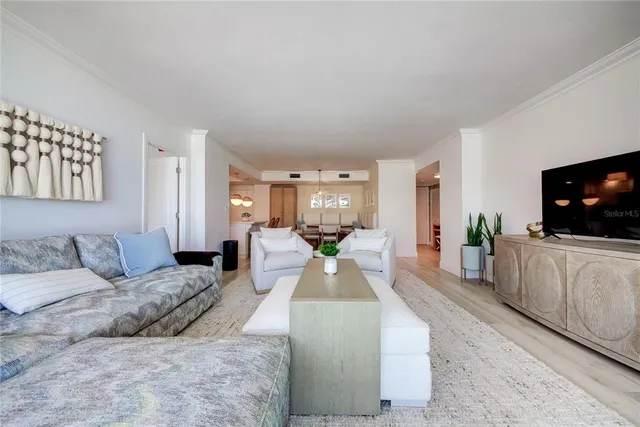 a kitchen with kitchen island granite countertop a sink a stove and cabinets