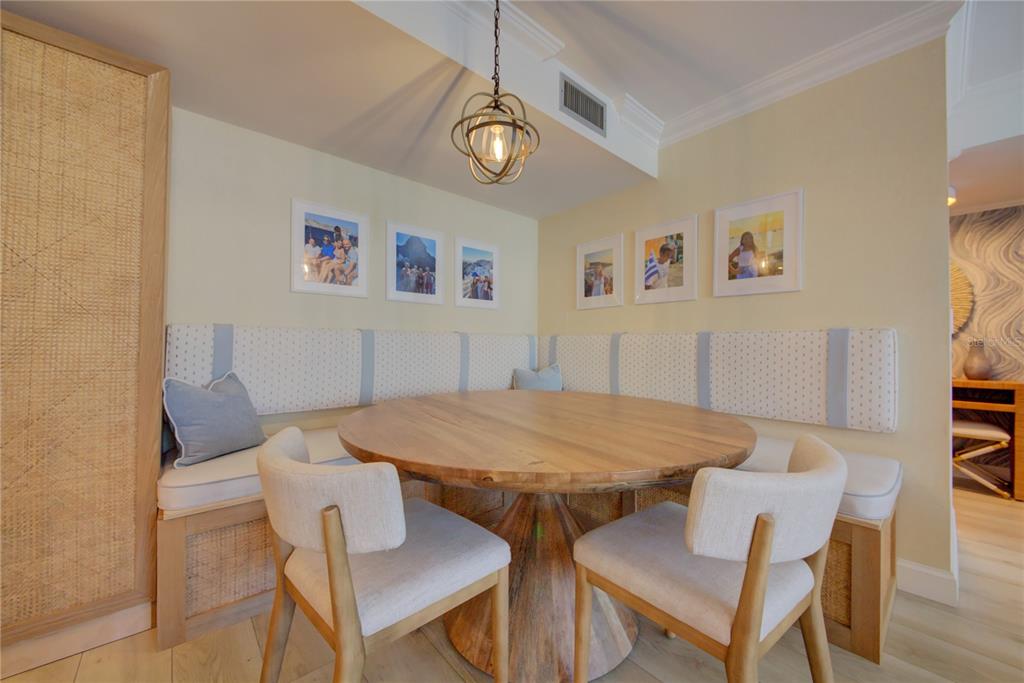 1212 Benjamin Franklin Drive, Unit 504 Sarasota, FL 34236 - Photo 14 of 48 a view of a dining room with furniture