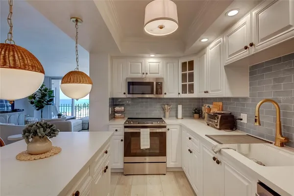 a bedroom with two beds and a couch