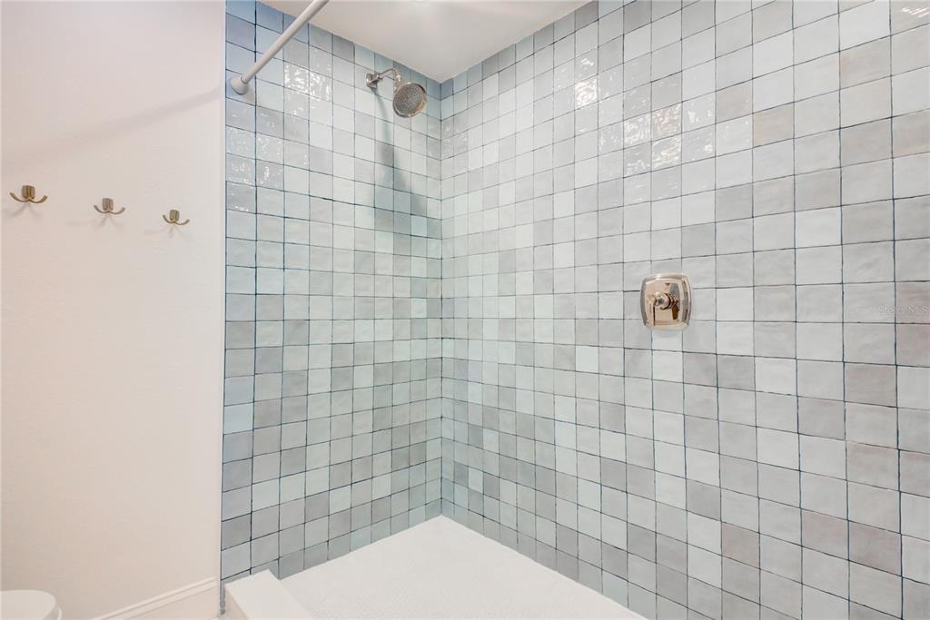 1212 Benjamin Franklin Drive, Unit 504 Sarasota, FL 34236 - Photo 30 of 48 a bathroom with a shower