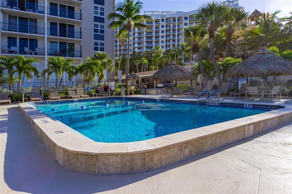 1212 Benjamin Franklin Drive, Unit 504 Sarasota, FL 34236 - Photo 34 of 48 a view of outdoor space yard swimming pool and patio