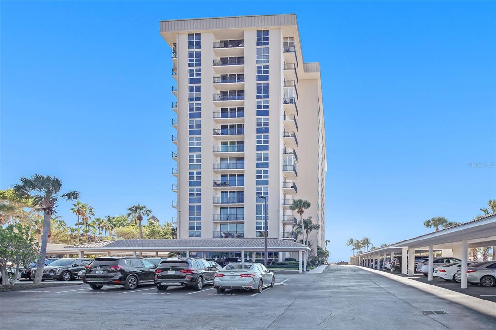 1212 Benjamin Franklin Drive, Unit 504 Sarasota, FL 34236 - Photo 40 of 48 a view of a building with car parked