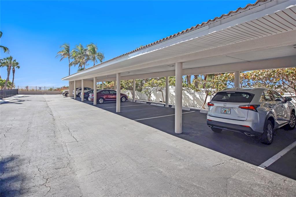 1212 Benjamin Franklin Drive, Unit 504 Sarasota, FL 34236 - Photo 41 of 48 a view of a parking area