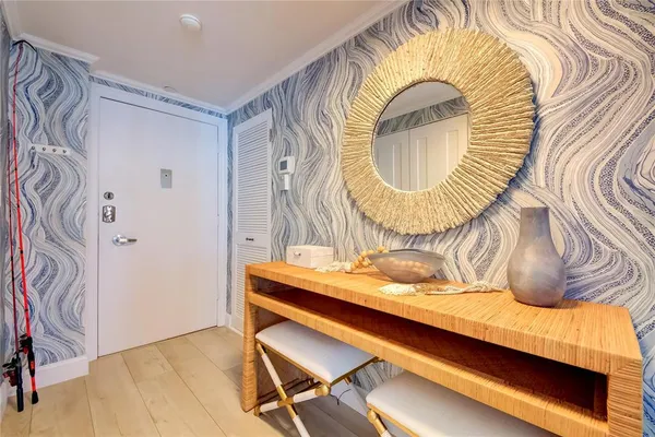 a living room with furniture a dining table and chairs with wooden floor