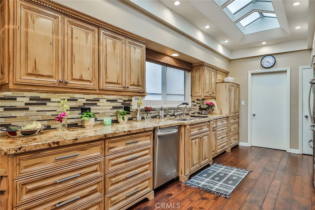 4575 De Celis Place Encino, CA 91436 - Photo 24 of 63 a kitchen with granite countertop cabinets and steel stainless steel appliances