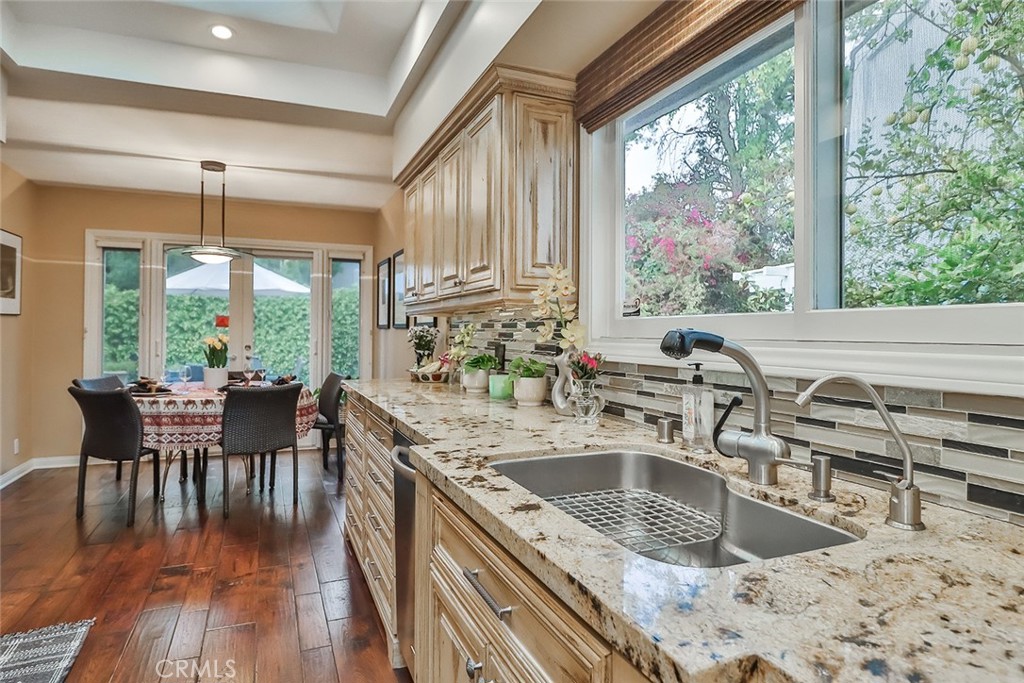 4575 De Celis Place Encino, CA 91436 - Photo 26 of 63 a kitchen filled counter top space with a large window
