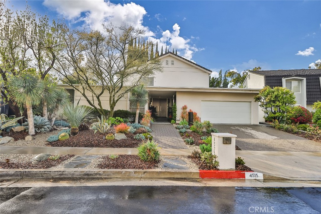4575 De Celis Place Encino, CA 91436 - Photo 3 of 63 front view of a house with a street