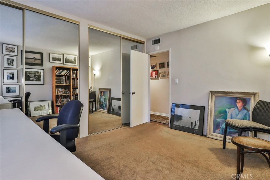 4575 De Celis Place Encino, CA 91436 - Photo 33 of 63 a view of a livingroom with furniture and a flat screen tv