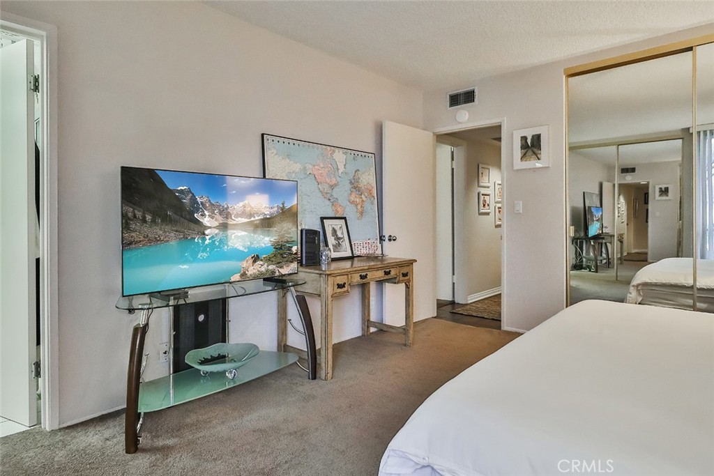 4575 De Celis Place Encino, CA 91436 - Photo 35 of 63 a living room with furniture a flat screen tv and outdoor view