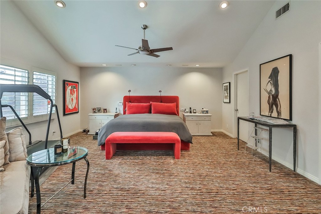 4575 De Celis Place Encino, CA 91436 - Photo 42 of 63 a bedroom with furniture and a mirror