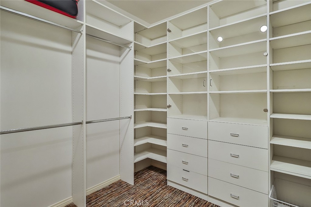 4575 De Celis Place Encino, CA 91436 - Photo 47 of 63 a view of walk in closet with empty racks