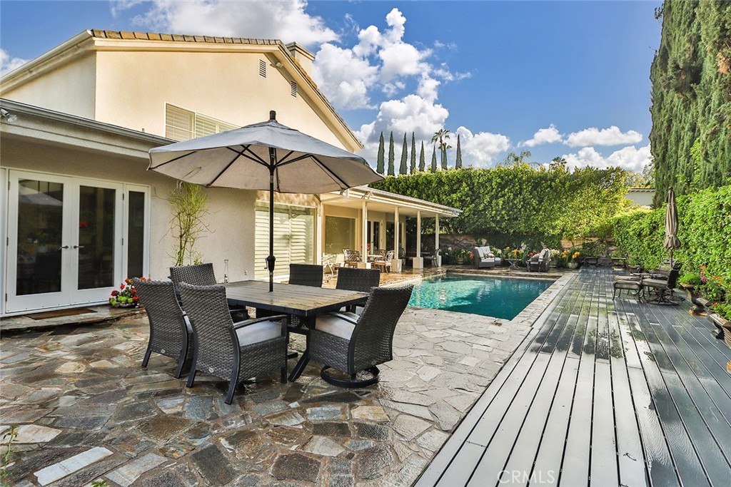 4575 De Celis Place Encino, CA 91436 - Photo 55 of 63 a view of a patio with table and chairs