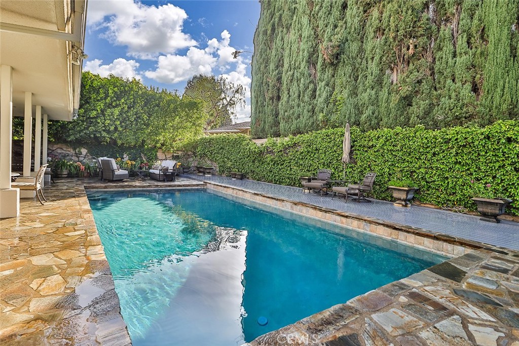 4575 De Celis Place Encino, CA 91436 - Photo 57 of 63 a view of a lake with a yard