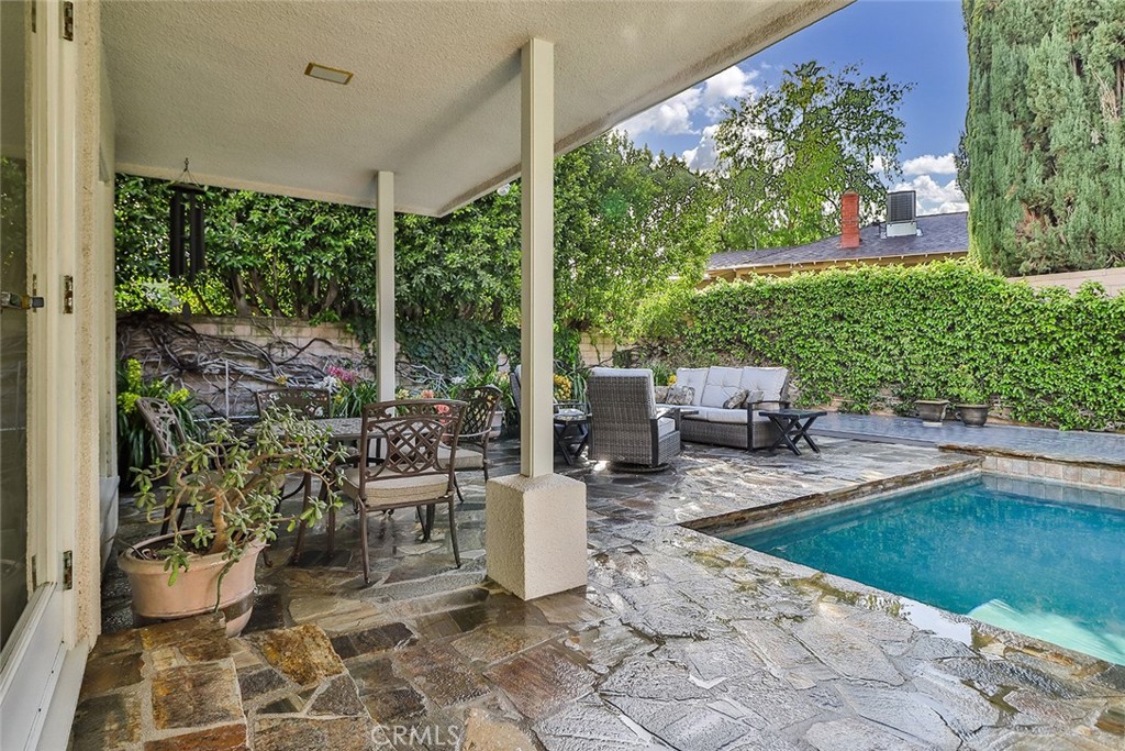 4575 De Celis Place Encino, CA 91436 - Photo 59 of 63 a view of a patio with chairs and potted plants