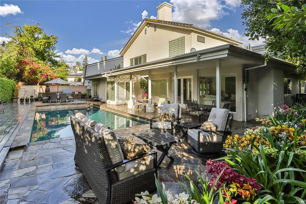 4575 De Celis Place Encino, CA 91436 - Photo 62 of 63 a view of a patio with table and chairs and potted plants
