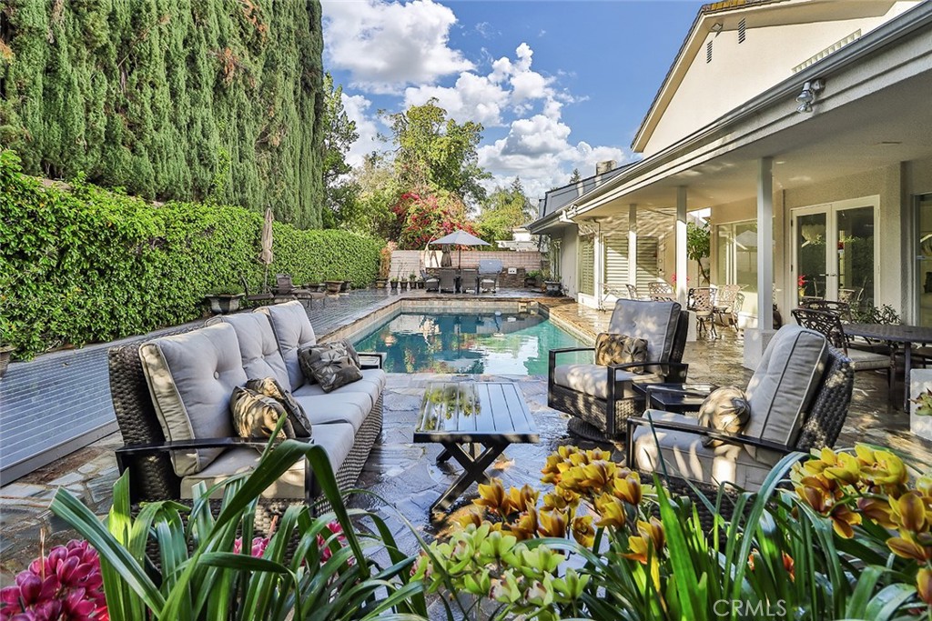 4575 De Celis Place Encino, CA 91436 - Photo 63 of 63 a view of a patio with table and chairs and potted plants
