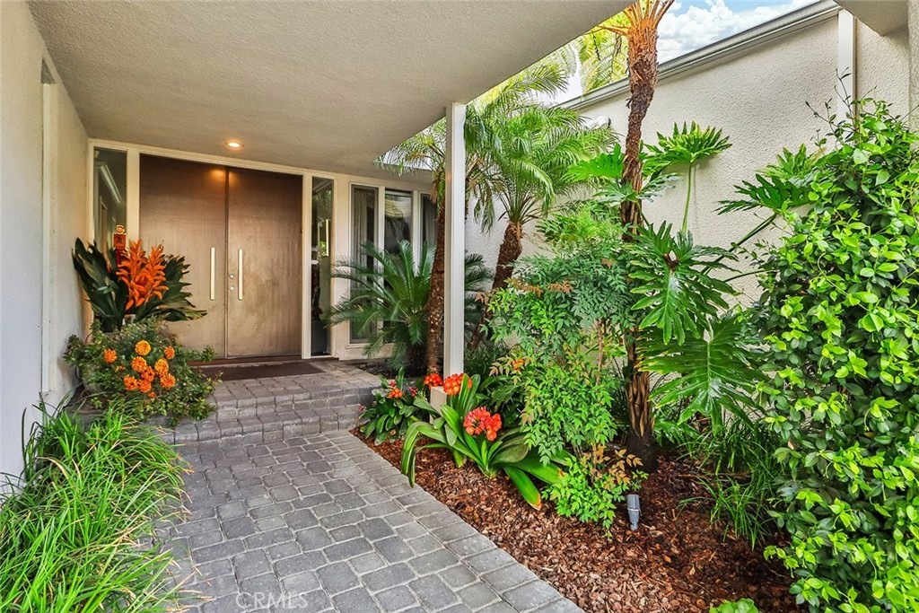 4575 De Celis Place Encino, CA 91436 - Photo 8 of 63 a vase of flowers sitting in front of a house