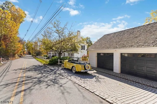 a front view of a house with a yard table and chairs