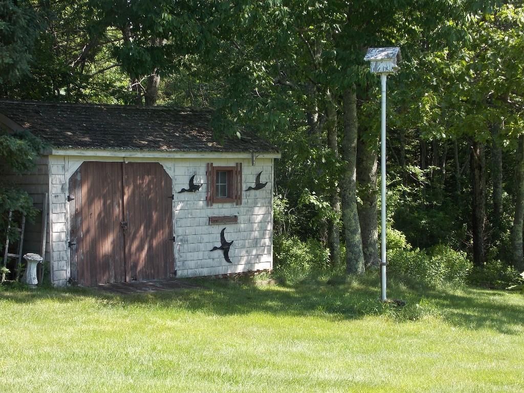 552 Front Ridge Road Orland, ME 04472 - Photo 14 of 26 Cute tool shed nestled in the trees.