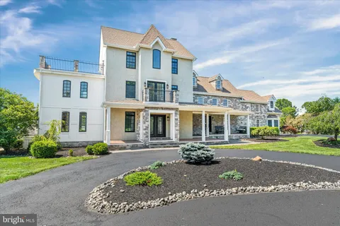 a front view of a residential apartment building with a yard