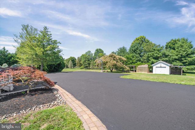 a view of a livingroom with furniture a fireplace